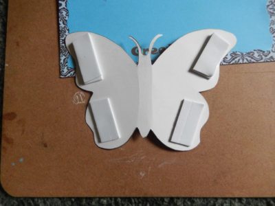 Butterfly wings raised with foam tape