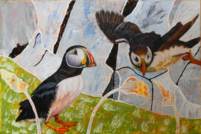 Two puffins on a cliff