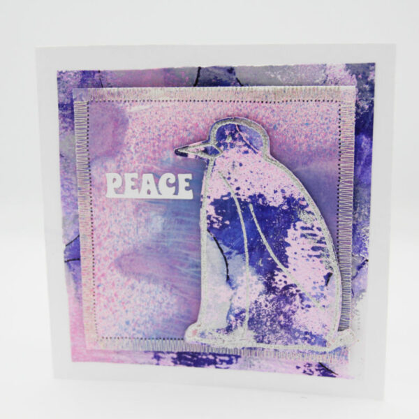 Purple penguin xmas card fron