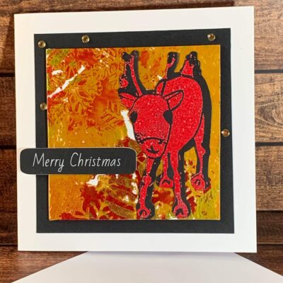 Cheerful Embossed Red Reindeer with Snowflake Detail