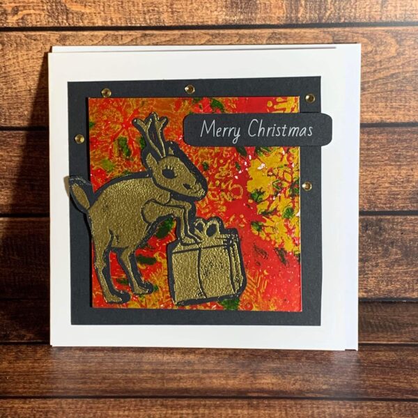 Awkward Gold Reindeer with Present on Xmas Print Card